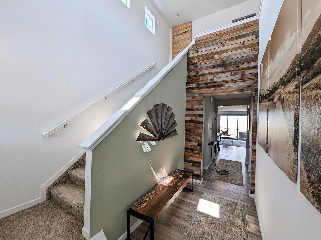 Entry with reclaimed-wood feature wall and windmill art