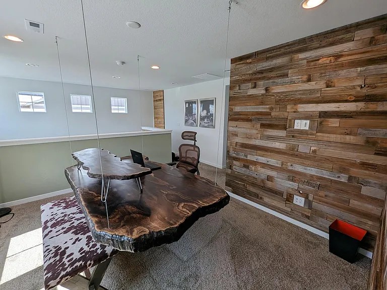 Loft: second dedicated workspace with reclaimed-wood wall